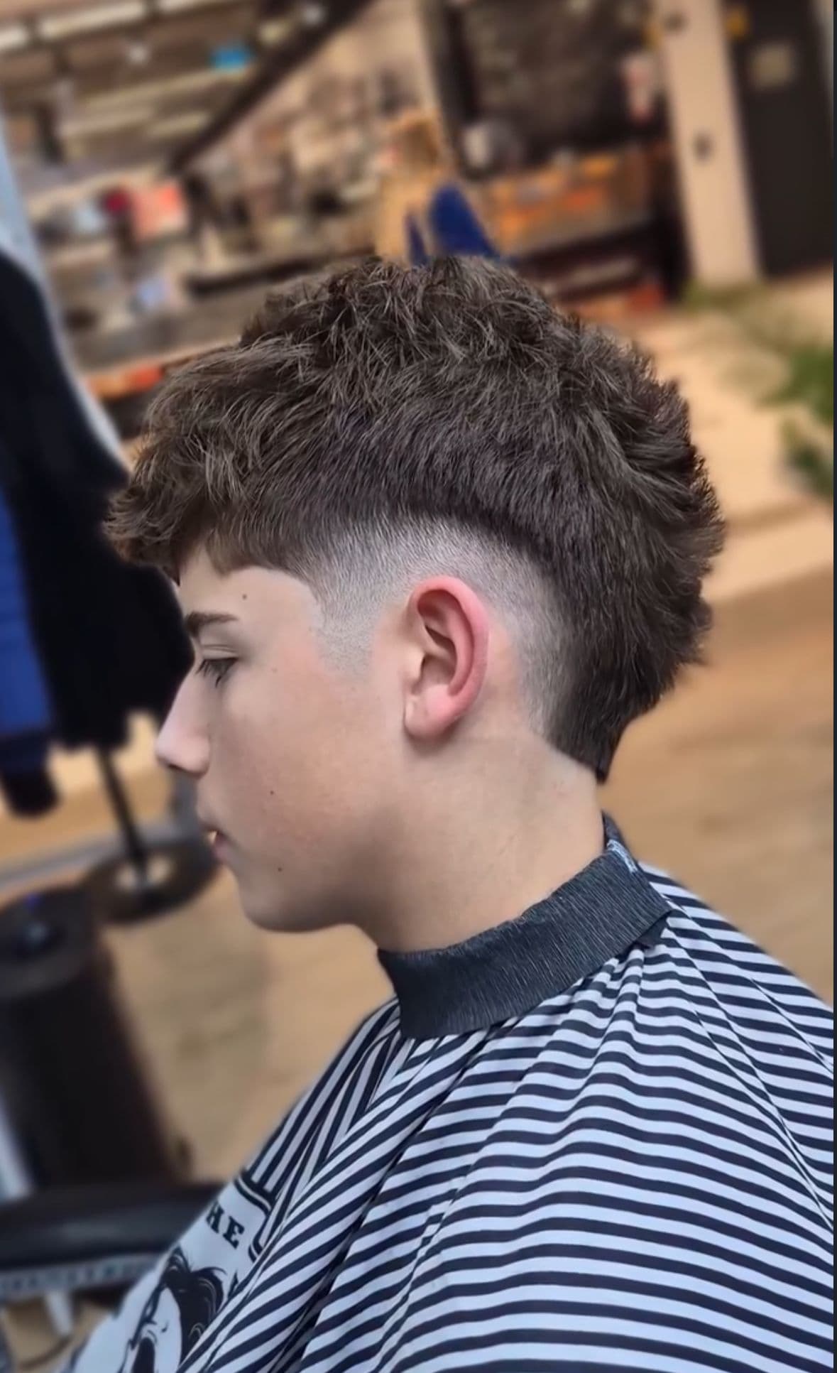Minimalist decor detail, such as a concrete wall with a neon sign.